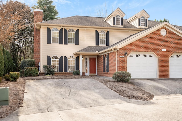 601 Black Oak Dr Unit 118, Dalton, GA 30721 - view of front of house with concrete driveway, a chimney, an attached garage, and brick siding