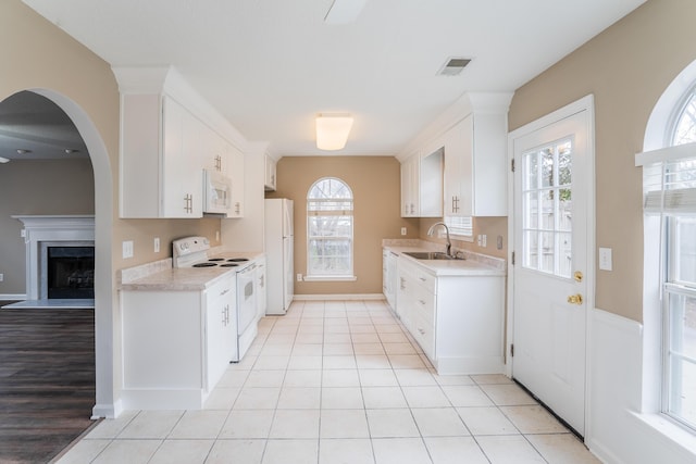 601 Black Oak Dr Unit 118, Dalton, GA 30721 - kitchen featuring white appliances, light countertops, plenty of natural light, and white cabinets