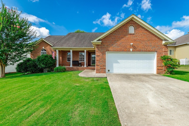 212 Cox Ln, Soddy Daisy, TN 37379 - ranch-style home with brick siding, a front yard, a porch, driveway, and a garage