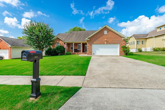 212 Cox Ln, Soddy Daisy, TN 37379 - ranch-style home featuring brick siding, a front yard, driveway, and an attached garage