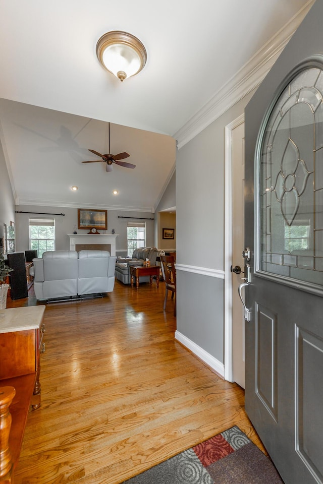 212 Cox Ln, Soddy Daisy, TN 37379 - entrance foyer featuring crown molding, a ceiling fan, light wood-type flooring, and vaulted ceiling