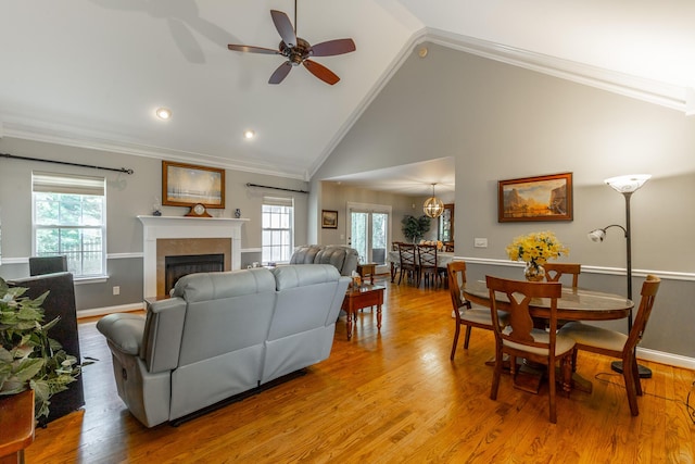 212 Cox Ln, Soddy Daisy, TN 37379 - living room with vaulted ceiling, ornamental molding, healthy amount of natural light, a fireplace, and ceiling fan