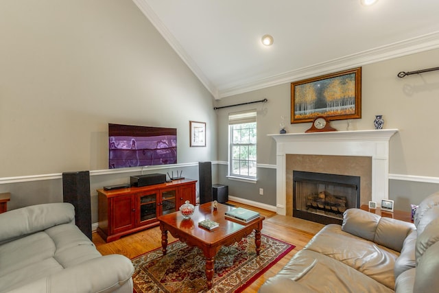212 Cox Ln, Soddy Daisy, TN 37379 - living room featuring crown molding, lofted ceiling, light wood finished floors, a fireplace, and recessed lighting