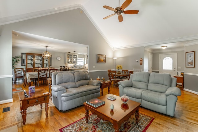 212 Cox Ln, Soddy Daisy, TN 37379 - living room with plenty of natural light, light wood-type flooring, ceiling fan, crown molding, and high vaulted ceiling