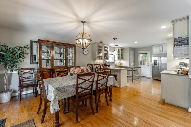 212 Cox Ln, Soddy Daisy, TN 37379 - dining space with a chandelier, light wood-type flooring, and recessed lighting