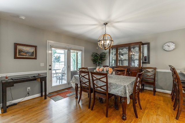 212 Cox Ln, Soddy Daisy, TN 37379 - dining area with a chandelier and light wood-type flooring