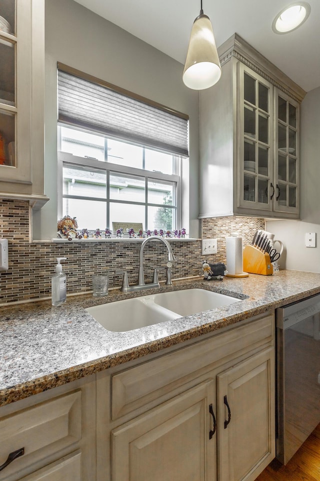 212 Cox Ln, Soddy Daisy, TN 37379 - kitchen with stainless steel dishwasher, backsplash, glass insert cabinets, and light stone countertops
