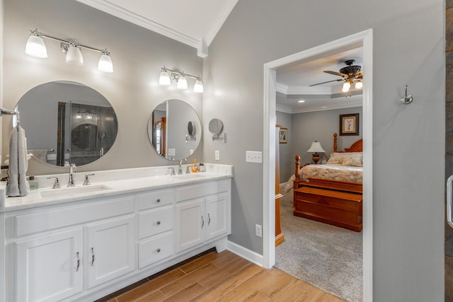 212 Cox Ln, Soddy Daisy, TN 37379 - bathroom featuring ensuite bathroom, ornamental molding, a ceiling fan, double vanity, and wood finished floors