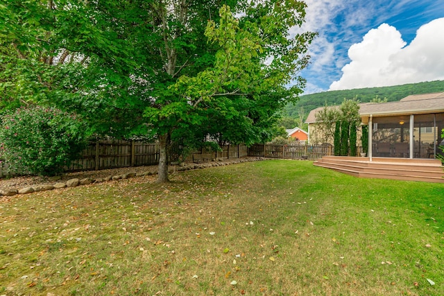 212 Cox Ln, Soddy Daisy, TN 37379 - fenced backyard with a sunroom
