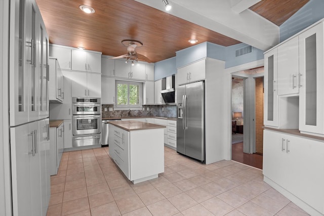 2554 Crestwood Dr, Chattanooga, TN 37415 - kitchen featuring appliances with stainless steel finishes, a warming drawer, wood ceiling, ceiling fan, and light tile patterned floors