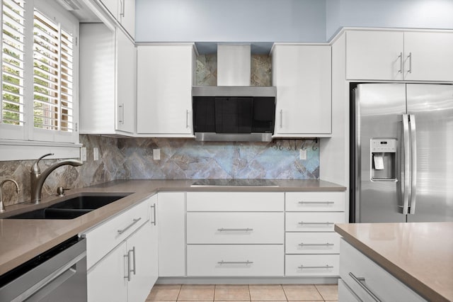 2554 Crestwood Dr, Chattanooga, TN 37415 - kitchen featuring appliances with stainless steel finishes, ventilation hood, light countertops, and tasteful backsplash