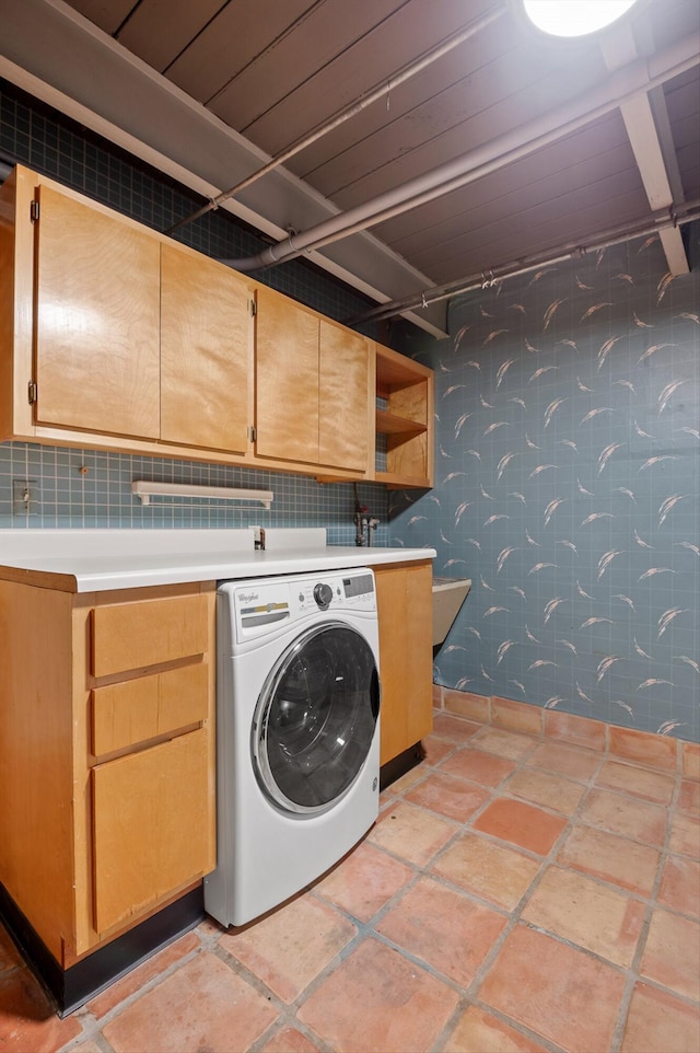 2554 Crestwood Dr, Chattanooga, TN 37415 - laundry area featuring washer / dryer, cabinet space, and stone tile floors