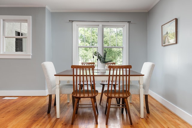 11387 Spring St, Soddy Daisy, TN 37379 - dining space with wood finished floors and crown molding