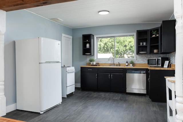 11387 Spring St, Soddy Daisy, TN 37379 - kitchen with stainless steel appliances, open shelves, dark cabinets, dark wood-style flooring, and tasteful backsplash
