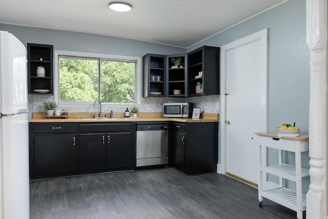 11387 Spring St, Soddy Daisy, TN 37379 - kitchen with appliances with stainless steel finishes, open shelves, dark cabinetry, tasteful backsplash, and dark wood-style flooring