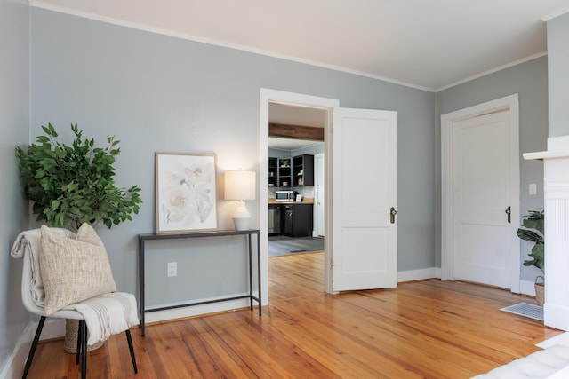 11387 Spring St, Soddy Daisy, TN 37379 - sitting room featuring wood finished floors and crown molding
