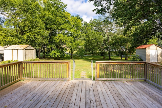 11387 Spring St, Soddy Daisy, TN 37379 - deck featuring a shed, a lawn, and view of scattered trees