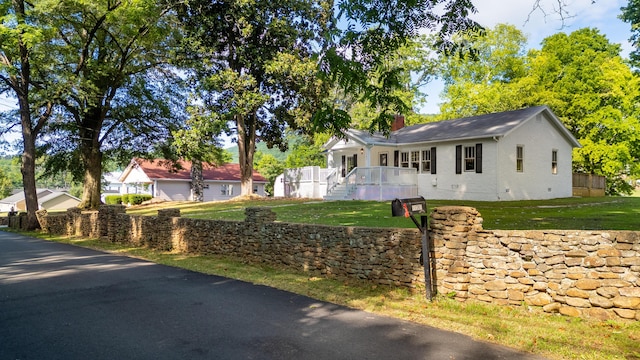11387 Spring St, Soddy Daisy, TN 37379 - single story home featuring a front lawn and a chimney