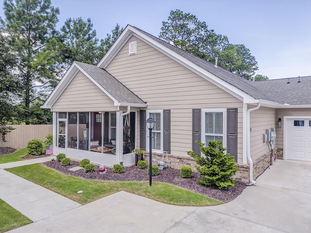 320 Kempton Ln Unit 2, Dalton, GA 30721 - view of front of home with a sunroom, a shingled roof, a garage, and concrete driveway