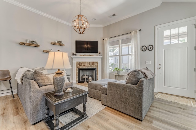 320 Kempton Ln Unit 2, Dalton, GA 30721 - living area featuring a chandelier, light wood-style floors, ornamental molding, and a fireplace