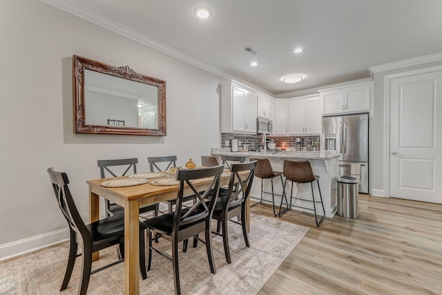 320 Kempton Ln Unit 2, Dalton, GA 30721 - dining area featuring light wood-style flooring, ornamental molding, and recessed lighting