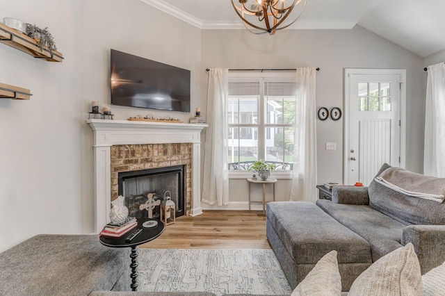 320 Kempton Ln Unit 2, Dalton, GA 30721 - living room with a chandelier, wood finished floors, a fireplace, ornamental molding, and vaulted ceiling