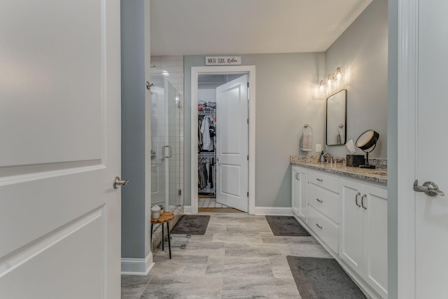 320 Kempton Ln Unit 2, Dalton, GA 30721 - full bathroom with vanity, a shower stall, and a walk in closet