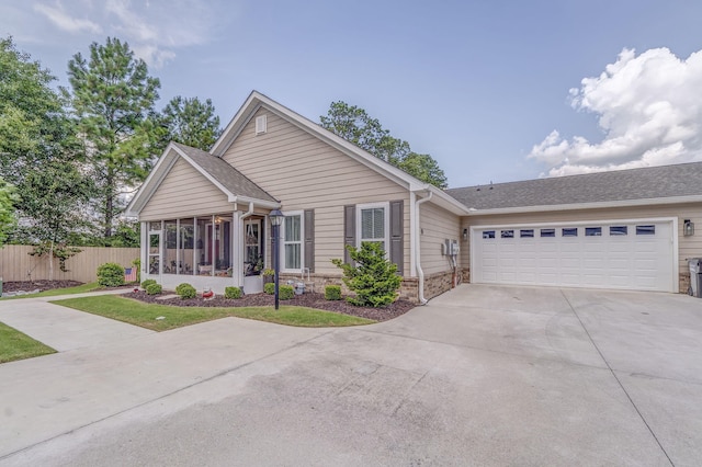 320 Kempton Ln Unit 2, Dalton, GA 30721 - view of front facade featuring concrete driveway, a sunroom, an attached garage, and a shingled roof