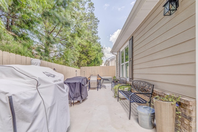 320 Kempton Ln Unit 2, Dalton, GA 30721 - fenced backyard featuring a grill and a patio area