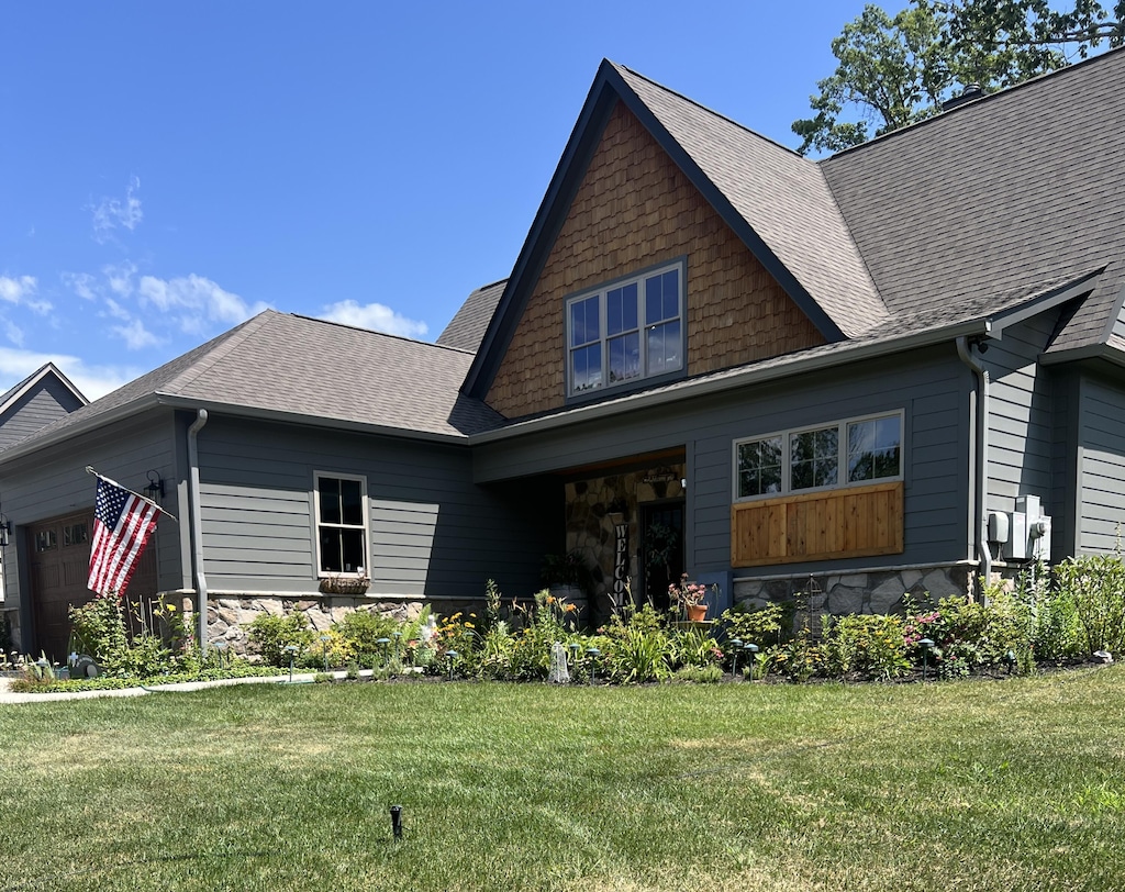 1930 Corral Rd, Signal Mountain, TN 37377 - view of front of home with stone siding, a front lawn, and a garage