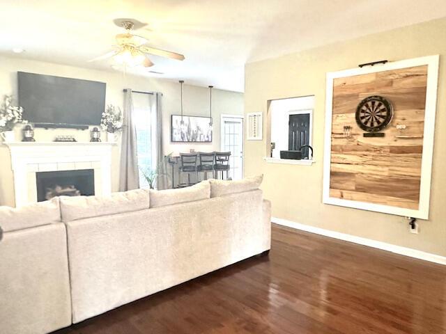 8041 Hamilton Mill Dr, Chattanooga, TN 37421 - living area with a ceiling fan, dark wood-type flooring, and a fireplace