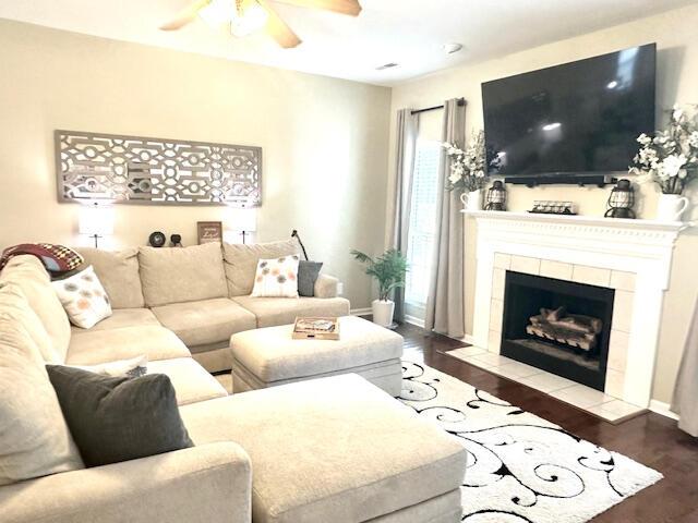 8041 Hamilton Mill Dr, Chattanooga, TN 37421 - living area with a ceiling fan, wood finished floors, and a fireplace