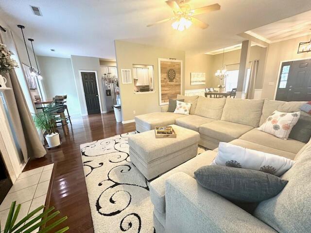 8041 Hamilton Mill Dr, Chattanooga, TN 37421 - living room with a chandelier, wood finished floors, and ceiling fan