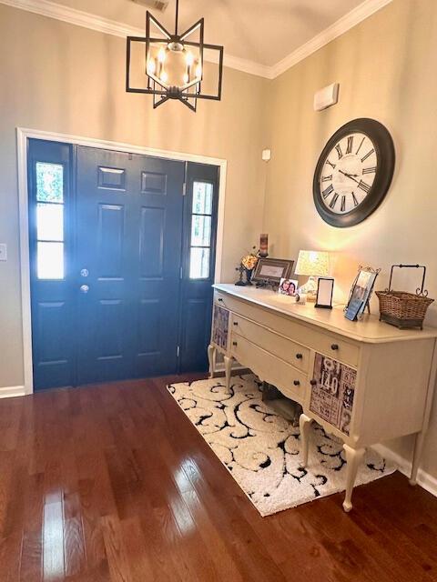 8041 Hamilton Mill Dr, Chattanooga, TN 37421 - foyer entrance featuring dark wood-style flooring, crown molding, and a chandelier