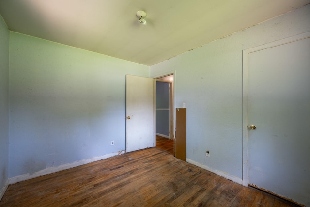 7635 Austin Dr, Chattanooga, TN 37416 - unfurnished bedroom featuring wood finished floors and baseboards