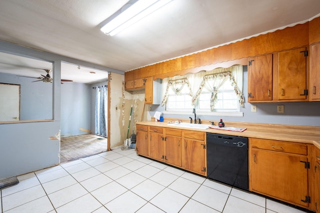 7635 Austin Dr, Chattanooga, TN 37416 - kitchen with black dishwasher, light countertops, and brown cabinetry