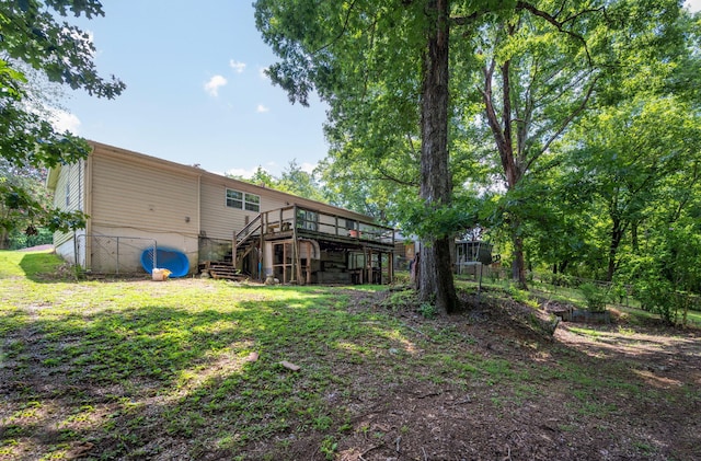 7635 Austin Dr, Chattanooga, TN 37416 - back of house with stairway and a wooden deck