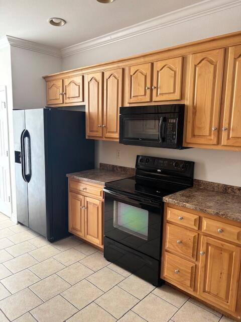 731 Callaway Ct, Chattanooga, TN 37421 - kitchen with black appliances, light tile patterned floors, dark countertops, and ornamental molding