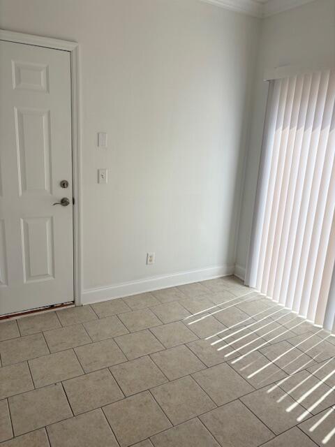 731 Callaway Ct, Chattanooga, TN 37421 - empty room featuring ornamental molding and light tile patterned floors