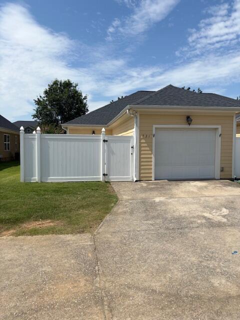 731 Callaway Ct, Chattanooga, TN 37421 - view of property exterior featuring concrete driveway, an attached garage, and a gate