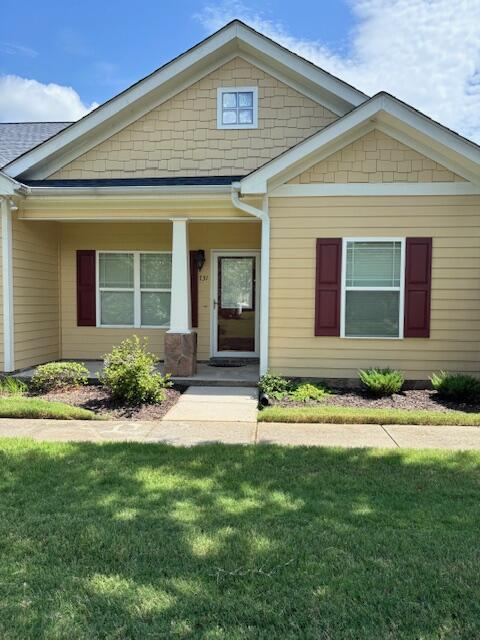 731 Callaway Ct, Chattanooga, TN 37421 - view of front of house with a front lawn and covered porch