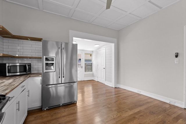 6863 Standifer Gap Rd, Chattanooga, TN 37421 - kitchen featuring stainless steel appliances, open shelves, dark wood-style flooring, white cabinetry, and butcher block countertops