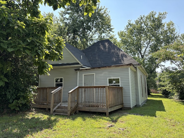 4005 Highland Ave, Chattanooga, TN 37410 - back of house featuring a wooden deck, a lawn, and a shingled roof