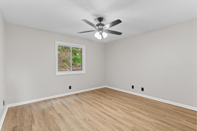 2219 Rocky Face Cir, Dalton, GA 30720 - unfurnished room with light wood-type flooring, a textured ceiling, and a ceiling fan