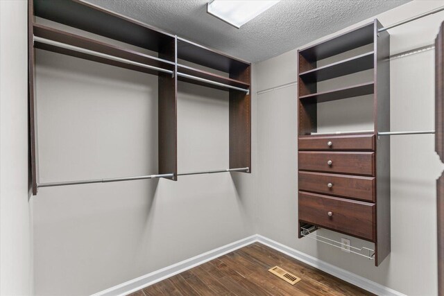 2219 Rocky Face Cir, Dalton, GA 30720 - walk in closet with dark wood-style floors