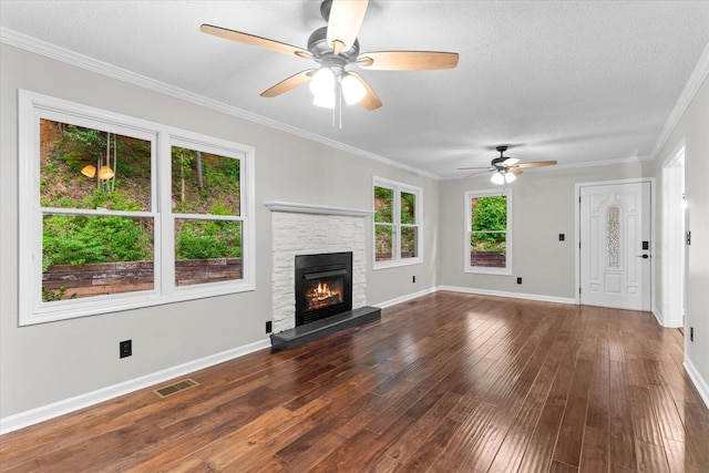 2219 Rocky Face Cir, Dalton, GA 30720 - unfurnished living room with ceiling fan, wood finished floors, a fireplace, ornamental molding, and a textured ceiling
