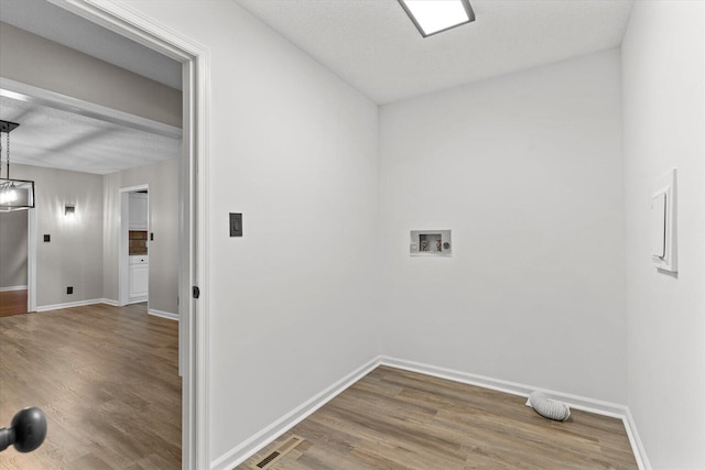 2219 Rocky Face Cir, Dalton, GA 30720 - laundry area with wood finished floors, washer hookup, and a chandelier