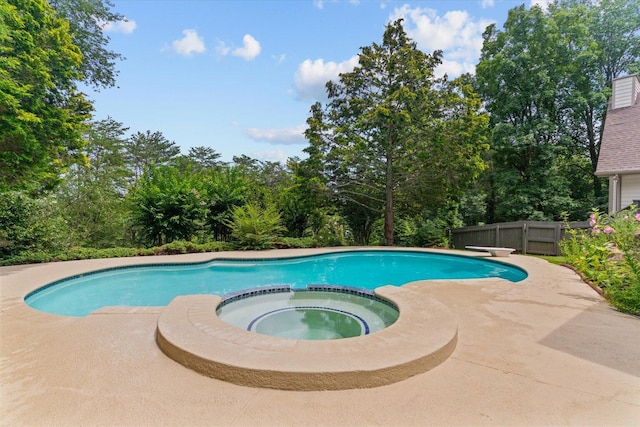 2219 Rocky Face Cir, Dalton, GA 30720 - view of swimming pool featuring a pool with connected hot tub and view of wooded area