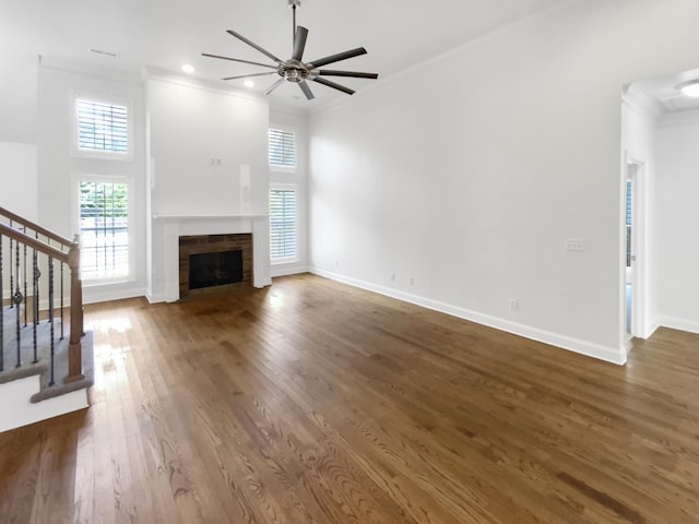 1783 Andover Pl, Chattanooga, TN 37421 - unfurnished living room with ornamental molding, ceiling fan, stairs, wood finished floors, and a fireplace