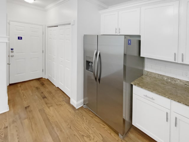 1783 Andover Pl, Chattanooga, TN 37421 - kitchen with ornamental molding, stainless steel fridge, decorative backsplash, white cabinets, and stone counters